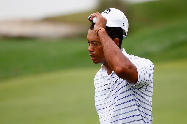 LOUISVILLE, KY - AUGUST 08: Tiger Woods of the United States tips his cap after playing the 18th hole during the second round of the 96th PGA Championship at Valhalla Golf Club on August 8, 2014 in Louisville, Kentucky.  (Photo by Sam Greenwood/Getty Images)