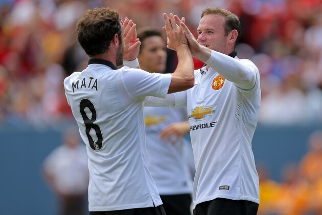 DENVER, CO - JULY 26: Wayne Rooney #10 of Manchester United celebrates his second goal with Juan Mata #8 during the first half of an International Champions Cup match against AS Roma at Sports Authority Field at Mile High on July 26, 2014 in Denver, Colorado. (Photo by Justin Edmonds/Getty Images)
