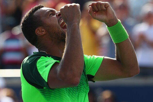 TORONTO, ON - AUGUST 10:  Jo-Wilfried Tsonga of France celebrates his win against Roger Federer of Switzerland during Rogers Cup at Rexall Centre at York University on August 10, 2014 in Toronto, Canada.  (Photo by Ronald Martinez/Getty Images)