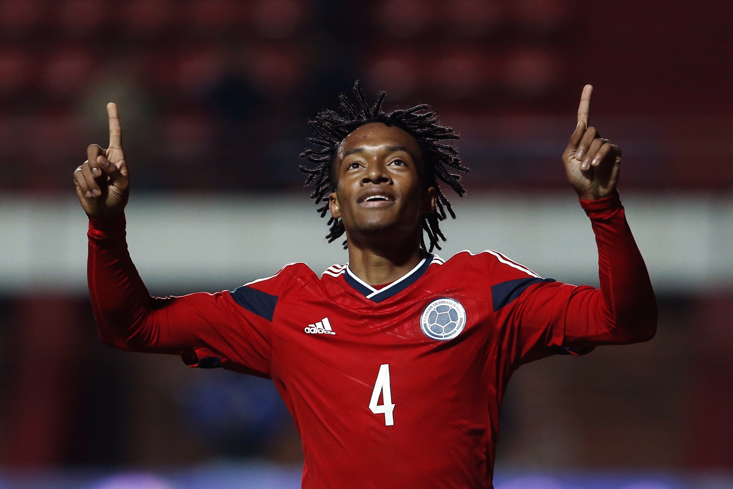 Colombia's Juan Cuadrado celebrates after scoring against Jordan during their international friendly soccer match in Buenos Aires, Argentina, Friday, June 6, 2014. (AP Photo/Victor R. Caivano)