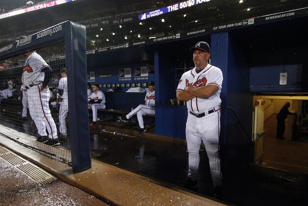 Aug 8, 2014; Atlanta, GA, USA; Atlanta Braves manager Fredi Gonzalez (33) in the dugout during a rain delay against the Washington Nationals in the sixth inning at Turner Field. Mandatory Credit: Brett Davis-USA TODAY Sports