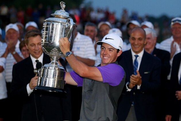 LOUISVILLE, KY - AUGUST 10:  Rory McIlroy of Northern Ireland celebrates with the Wanamaker trophy after his one-stroke victory during the final round of the 96th PGA Championship at Valhalla Golf Club on August 10, 2014 in Louisville, Kentucky.  (Photo by Andrew Redington/Getty Images)