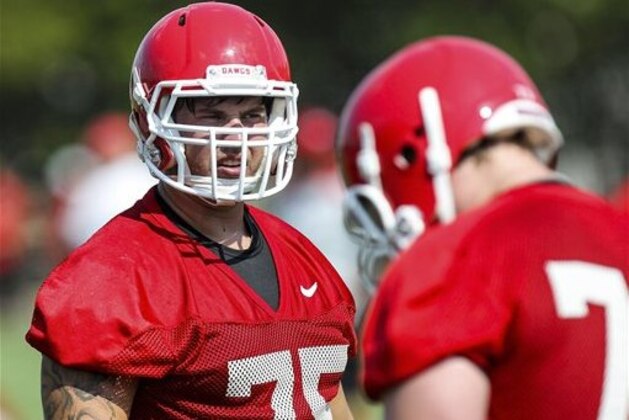 Georgia offensive tackle Kolton Houston (75) stands on the field during NCAA college football practice in Athens, Ga., on Thursday, Aug. 2, 2012. (AP Photo/Daniel Shirey)