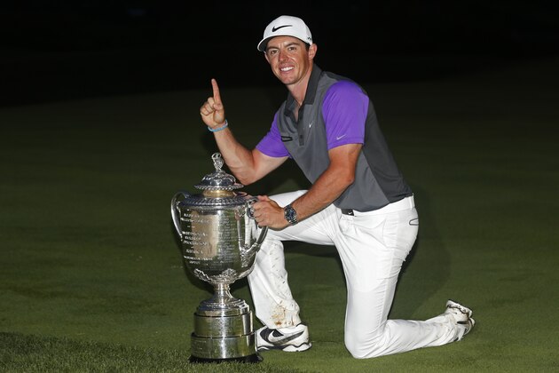 Rory McIlroy, of Northern Ireland, holds up the Wanamaker Trophy after winning the PGA Championship golf tournament at Valhalla Golf Club on Sunday, Aug. 10, 2014, in Louisville, Ky.  (AP Photo/Mike Groll)