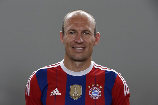 Bayern Munich's Arjen Robben of the Netherlands poses during an official photo shooting for the new German first division Bundesliga season, in Munich, southern Germany, Saturday, Aug. 9, 2014. (AP Photo/Matthias Schrader)
