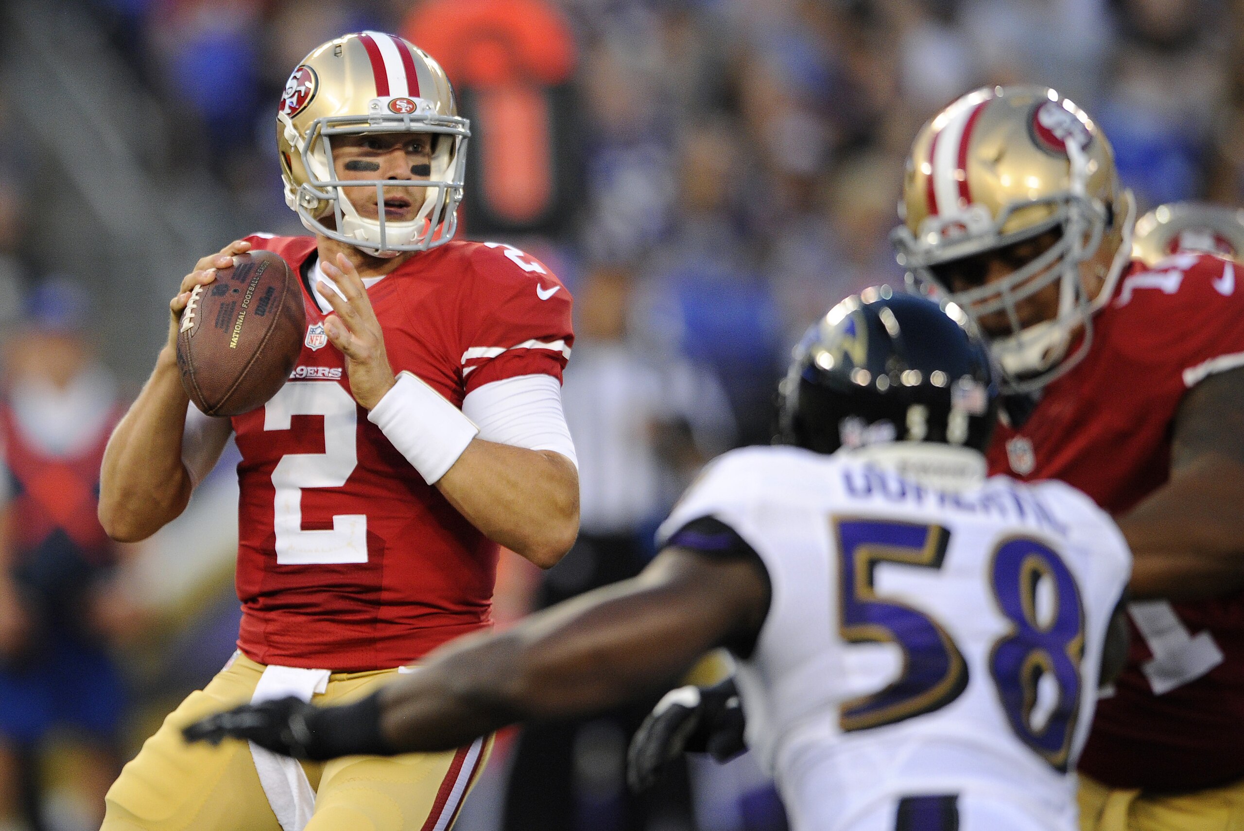 San Francisco 49ers quarterback Blaine Gabbert (2) looks for a receiver as he is pressured by Baltimore Ravens outside linebacker Elvis Dumervil (58) in the first half of an NFL preseason football game, Thursday, Aug. 7, 2014, in Baltimore. (AP Photo/Nick Wass) San Francisco 49ers quarterback Blaine Gabbert (2) looks for a receiver as he is pressured by Baltimore Ravens outside linebacker Elvis Dumervil (58) in the first half of an NFL preseason football game, Thursday, Aug. 7, 2014, in Baltimore. (AP Photo/Nick Wass)