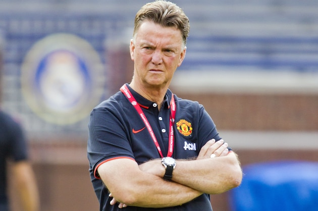 Manchester United manager Louis van Gaal watches his team during a training session, Friday, Aug. 1, 2014, at Michigan Stadium in Ann Arbor, Mich. Real Madrid will face Manchester United in a Guinness International Champions Cup match Saturday at this college football stadium. (AP Photo/Tony Ding)