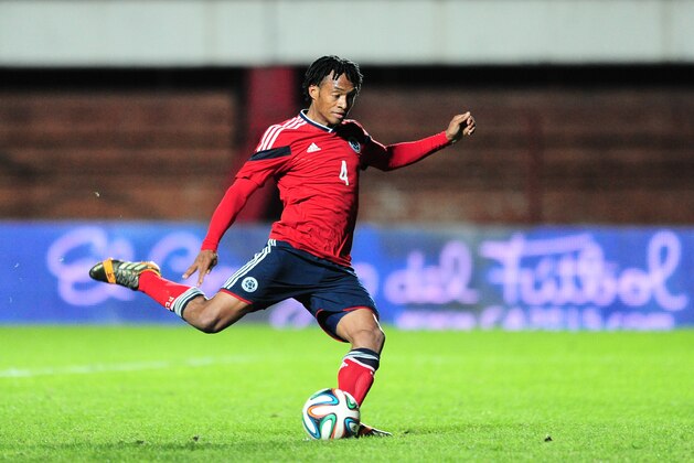 BUENOS AIRES, ARGENTINA - JUNE 06: Juan Cuadrado of Colombia shoots a penalty kick to score the second goal during the International Friendly Match between Colombia and Jordan at Pedro Bidegain Stadium on June 06, 2014 in Buenos Aires, Argentina. (Photo by Alfredo Herms/Getty Images)