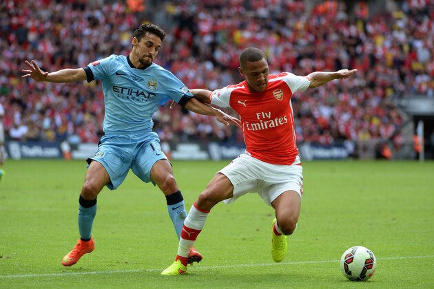 LONDON, ENGLAND - AUGUST 10: Kieran Gibbs of Arsenal competes with Jesus Navas of Manchester City during the FA Community Shield match between Manchester City and Arsenal at Wembley Stadium on August 10, 2014 in London, England. (Photo by Ross Kinnaird/Getty Images) LONDON, ENGLAND - AUGUST 10: Kieran Gibbs of Arsenal competes with Jesus Navas of Manchester City during the FA Community Shield match between Manchester City and Arsenal at Wembley Stadium on August 10, 2014 in London, England. (Photo by Ross Kinnaird/Getty Images)