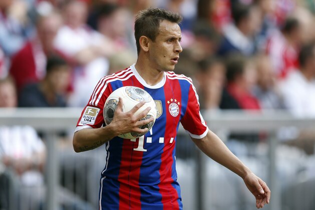 Bayern's Rafinha of Brazil watches his team during the German first division Bundesliga soccer match between FC Bayern Munich and VfB Stuttgart, in Munich, southern Germany, Saturday, May 10, 2014. (AP Photo/Matthias Schrader)