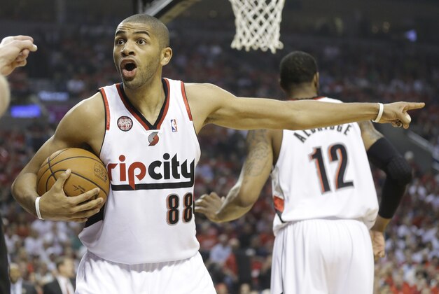 Portland Trail Blazers' Nicolas Batum (88) reacts to a call in the first quarter during Game 4 of a Western Conference semifinal NBA basketball playoff series against the San Antonio Spurs Monday, May 12, 2014, in Portland, Ore. (AP Photo/Rick Bowmer)