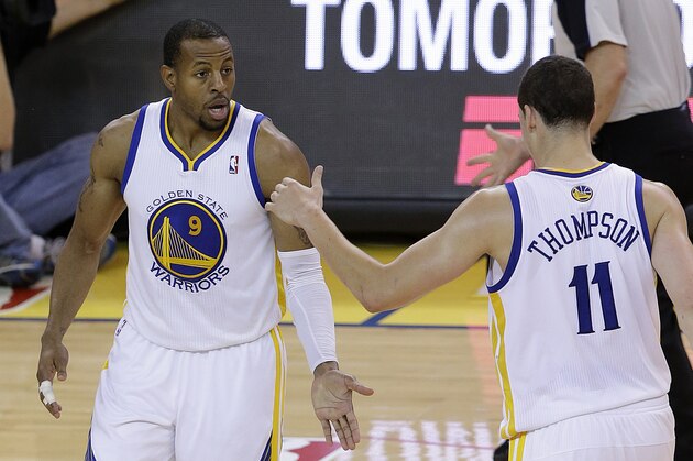 Golden State Warriors small forward Andre Iguodala (9) is congratulated by shooting guard Klay Thompson (11) after making a three point basket against the Los Angeles Clippers during the fourth quarter of Game 6 of an opening-round NBA basketball playoff series in Oakland, Calif., Thursday, May 1, 2014. The Warriors won 100-99. (AP Photo/Jeff Chiu)