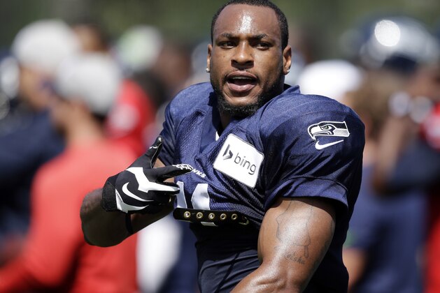 Seattle Seahawks' Percy Harvin stands on the sidelines at an NFL football camp practice Sunday, July 27, 2014, in Renton, Wash. (AP Photo/Elaine Thompson)