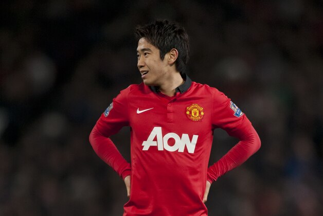 Manchester United's Shinji Kagawa waits for the ball during his team's English Premier League soccer match against Everton at Old Trafford Stadium, Manchester, England, Wednesday Dec. 4, 2013. (AP Photo/Jon Super)