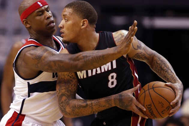 Washington Wizards forward Al Harrington (7) guards Miami Heat forward Michael Beasley (8) in the second half of an NBA basketball game, Monday, April 14, 2014, in Washington. The Wizards won 114-93. (AP Photo/Alex Brandon)