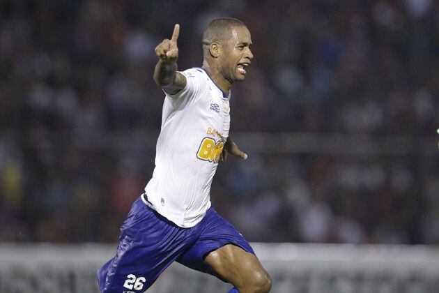 Dede of Brazil's Cruzeiro, celebrates after scoring against Paraguay's Cerro Porteno during a Copa Libertadores game in Asuncion, Paraguay, Wednesday, April 30, 2014. (AP Photo/Jorge Saenz)