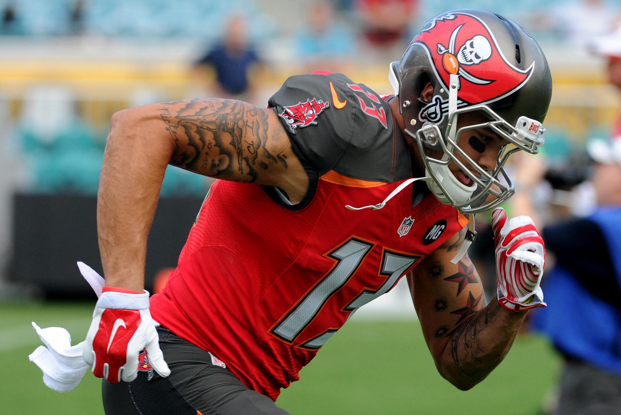 Aug 8, 2014; Jacksonville, FL, USA; Tampa Bay Buccaneers wide receiver Mike Evans (13) warms up prior to the preseason game against the Jacksonville Jaguars at EverBank Field. Mandatory Credit: Melina Vastola-USA TODAY Sports