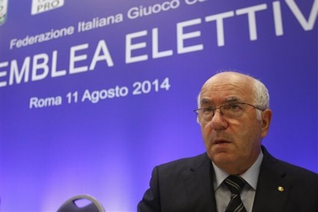 Italian Soccer Federation (FIGC) newly elected president Carlo Tavecchio reacts at the end of the national elective assembly at Fiumicino, near Rome, Monday, Aug. 11, 2014. Carlo Tavecchio has been elected the new president of the Italian football federation, replacing Giancarlo Abete. Despite allegations of racism marring his electoral campaign, Tavecchio beat Demetrio Albertini by a majority vote on Monday. (AP Photo/Riccardo De Luca)