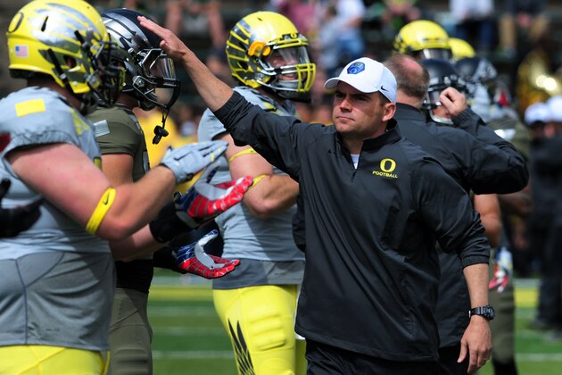 EUGENE, OR - MAY 3: Oregon Ducks head coach Mark Helfrich greets his players  before the Spring game at Autzen Stadium on May 3, 2014 in Eugene, Oregon. (Photo by Steve Dykes/Getty Images)