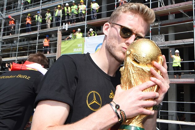 BERLIN, GERMANY - JULY 15: Andre Schuerrle celebrates during the German team victory ceremony on July 15, 2014 in Berlin, Germany. Germany won the 2014 FIFA World Cup Brazil match against Argentina in Rio de Janeiro on July 13.  (Photo by Markus Gilliar - Pool /Getty Images)