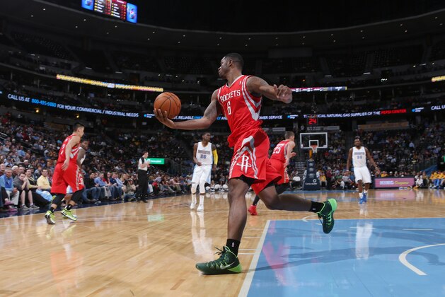 Houston Rockets forward Terrence Jones pulls in a loose ball against the Denver Nuggets in the third  quarter of the Nuggets' 123-116 victory in an NBA basketball game in Denver on Wednesday, April 9, 2014. (AP Photo/David Zalubowski)
