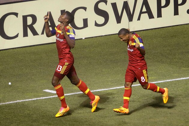 Real Salt Lake's Olmes Garcia (13) celebrates with Joao Plata (8) after scoring against the Montreal Impact during an MLS soccer game Thursday, July 24, 2014, in Sandy, Utah. (AP Photo/Rick Bowmer)