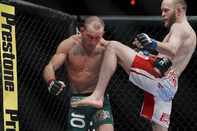 May 25, 2013; Las Vegas, NV, USA; TJ Grant knees Gray Maynard during UFC 160 at the MGM Grand Garden Arena. Mandatory Credit: Gary A. Vasquez-USA TODAY Sports May 25, 2013; Las Vegas, NV, USA; TJ Grant knees Gray Maynard during UFC 160 at the MGM Grand Garden Arena. Mandatory Credit: Gary A. Vasquez-USA TODAY Sports
