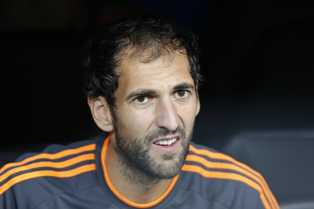 Real's goalkeeper Diego Lopez looks out from the bench before the start of a Group B Champions League soccer match between Real Madrid and Juventus at the Santiago Bernabeu stadium in Madrid, Spain, Wednesday Oct. 23, 2013. (AP Photo/Paul White)