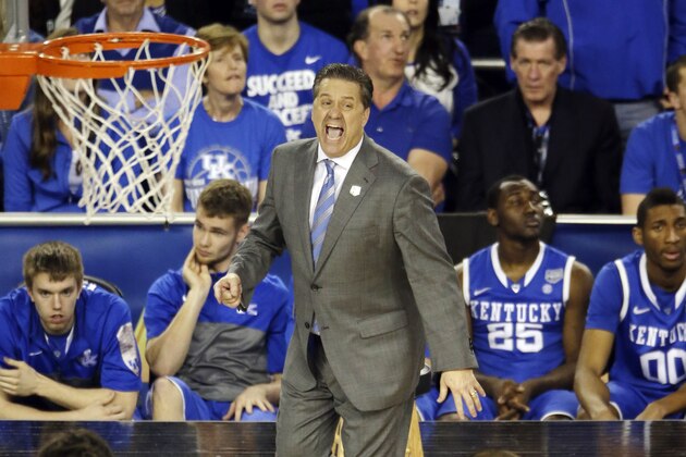 Kentucky head coach John Calipari works from the sideline against Wisconsin during the second half of the NCAA Final Four tournament college basketball semifinal game Saturday, April 5, 2014, in Arlington, Texas. Kentucky won 74-73. (AP Photo/Tony Gutierrez)