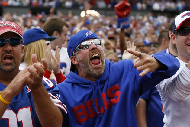 The Buffalo Bills fans celebrate a touchdown during an NFL football game against the Carolina Panthers Sunday, Sept. 15, 2013, in Orchard Park, N.Y. Buffalo defeated Carolina, 24-23. (AP Photo/Bill Wippert)
