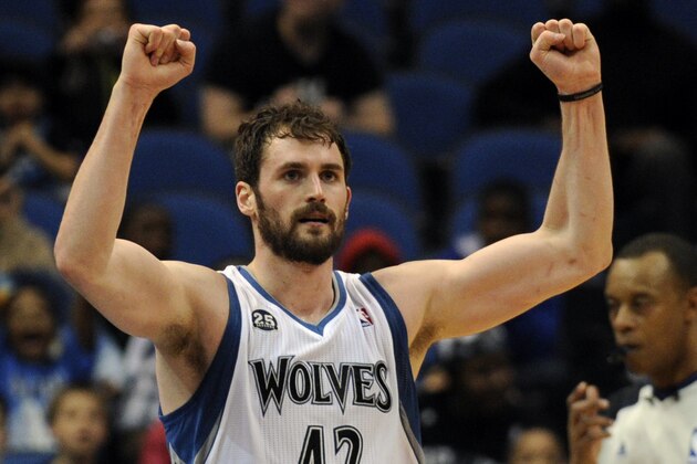 Minnesota Timberwolves forward Kevin Love (42) celebrates in an NBA basketball game against the San Antonio Spurs at the Target Center on in Minneapolis on Tuesday, April 8, 2014. (AP Photo/Hannah Foslien)