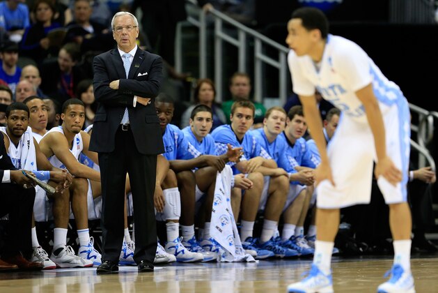 KANSAS CITY, MO - MARCH 22:  Head coach Roy Williams of the North Carolina Tar Heels watches play as Marcus Paige #5 stands on the court in the first half against the Villanova Wildcats during the second round of the 2013 NCAA Men's Basketball Tournament at the Sprint Center on March 22, 2013 in Kansas City, Missouri.  (Photo by Jamie Squire/Getty Images)