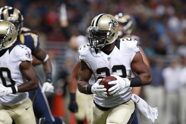 New Orleans Saints running back Mark Ingram (22) runs 22 yards for a touchdown against the St. Louis Rams in the second quarter of a preseason NFL football game Friday, Aug. 8, 2014, in St. Louis. (AP Photo/Scott Kane)