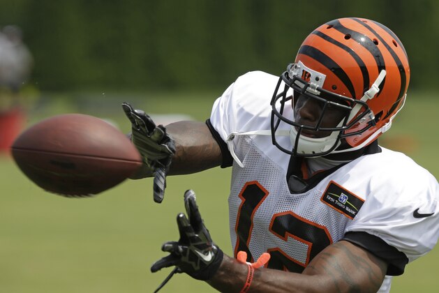Cincinnati Bengals wide receiver Mohamed Sanu catches a pass during practice at the NFL football team's training camp, Saturday, July 26, 2014, in Cincinnati.  (AP Photo/Al Behrman)
