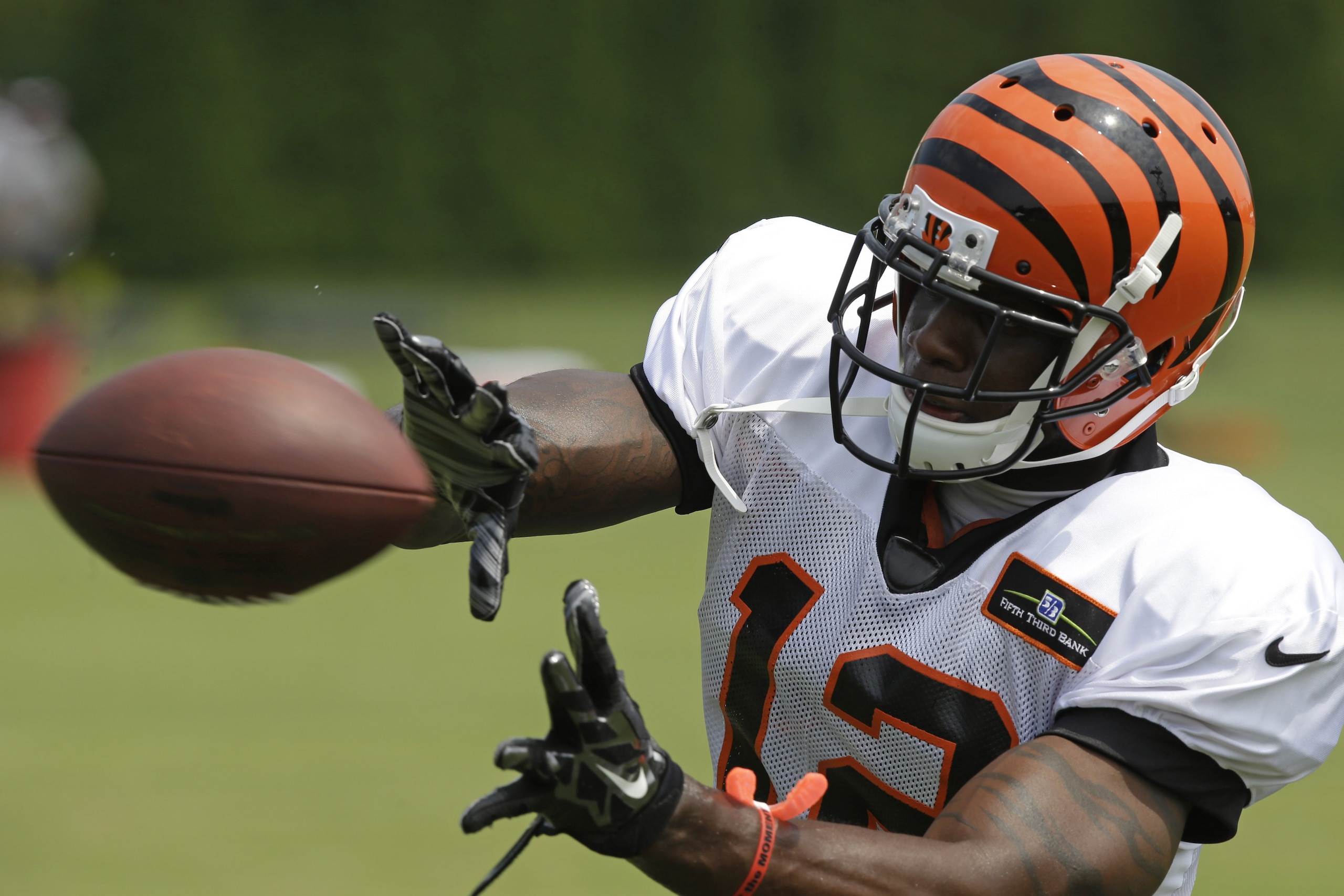 Cincinnati Bengals wide receiver Mohamed Sanu catches a pass during practice at the NFL football team's training camp, Saturday, July 26, 2014, in Cincinnati.  (AP Photo/Al Behrman)