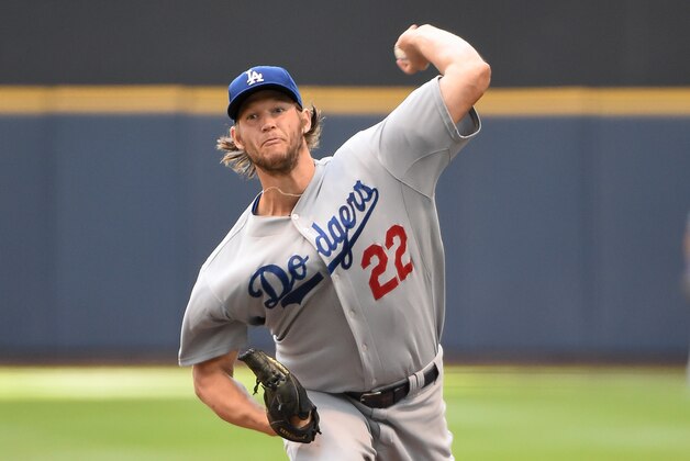 Aug 10, 2014; Milwaukee, WI, USA;  Los Angeles Dodgers pitcher Clayton Kershaw (22) pitches in the first inning against the Milwaukee Brewers at Miller Park. Mandatory Credit: Benny Sieu-USA TODAY Sports