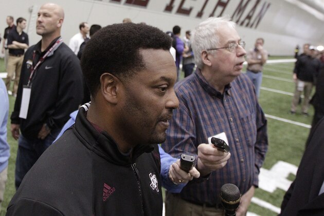 Texas A&M head coach Kevin Sumlin talks to members of the media during pro day for NFL football representatives in College Station, Texas, Thursday, March 27, 2014. (AP Photo/Patric Schneider)
