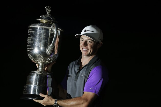 Rory McIlroy, of Northern Ireland, holds up the Wanamaker Trophy after winning the PGA Championship golf tournament at Valhalla Golf Club on Sunday, Aug. 10, 2014, in Louisville, Ky.  (AP Photo/David J. Phillip)