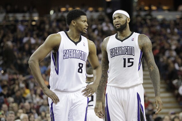 Sacramento Kings' Rudy Gay, left, and DeMarcus Cousins confer during an NBA basketball game against the Cleveland Cavaliers in Sacramento, Calif.,  Sunday, Jan. 12, 2014.  The Kings won 124-80.(AP Photo/Rich Pedroncelli)