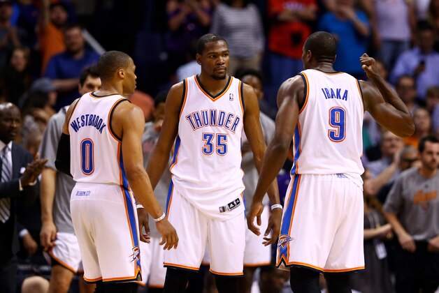Mar 6, 2014; Phoenix, AZ, USA; Oklahoma City Thunder guard Russell Westbrook (0) and forward Kevin Durant (35) argue with forward Serge Ibaka (9) in the closing seconds of the fourth quarter against the Phoenix Suns at the US Airways Center. The Suns defeated the Thunder 128-122. Mandatory Credit: Mark J. Rebilas-USA TODAY Sports