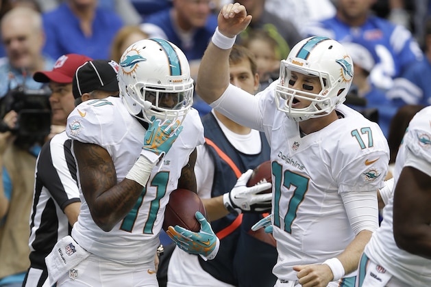 Miami Dolphins' Ryan Tannehill (17) celebrates with Mike Wallace (11) after Wallace scored on an 18-yard touchdown reception during the first half an NFL football game against the Indianapolis Colts Sunday, Sept. 15, 2013, in Indianapolis. (AP Photo/Michael Conroy) Miami Dolphins' Ryan Tannehill (17) celebrates with Mike Wallace (11) after Wallace scored on an 18-yard touchdown reception during the first half an NFL football game against the Indianapolis Colts Sunday, Sept. 15, 2013, in Indianapolis. (AP Photo/Michael Conroy)