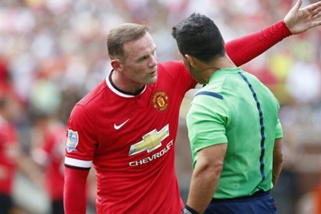 IMAGE DISTRIBUTED FOR GUINNESS INTERNATIONAL CHAMPIONS CUP - Manchester United forward Wayne Rooney (10) talks to Hilario Grajeda in the first half against the Real Madrid at Guinness International Champions Cup, on Saturday, August 2, 2014 in Ann Arbor, Michigan. (Rick Osentoski/AP Images for Guinness International Champions Cup)