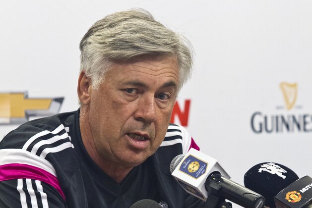 Real Madrid manager Carlo Ancelotti speaks at a pre-training press conference, Friday, Aug. 1, 2014, at Michigan Stadium in Ann Arbor, Mich. Real Madrid will face Manchester United in a Guinness International Champions Cup match Saturday at this college football stadium. (AP Photo/Tony Ding)