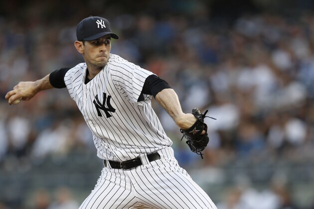 New York Yankees starting pitcher Brandon McCarthy delivers in the first inning of a baseball game against the Detroit Tigers at Yankee Stadium in New York, Tuesday, Aug. 5, 2014.  (AP Photo/Kathy Willens)