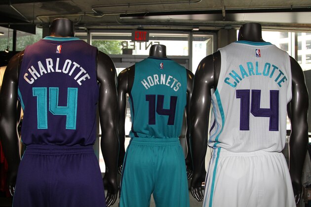 CHARLOTTE, NC - July 21 2014: Charlotte Hornets New uniforms at the Time Warner Cable Arena on July 21, 2014 in Charlotte, North Carolina. NOTE TO USER: User expressly acknowledges and agrees that, by downloading and or using this photograph, User is consenting to the terms and conditions of the Getty Images License Agreement.  Mandatory Copyright Notice:  Copyright 2014 NBAE (Photo by Brock Williams-Smith/NBAE via Getty Images)
