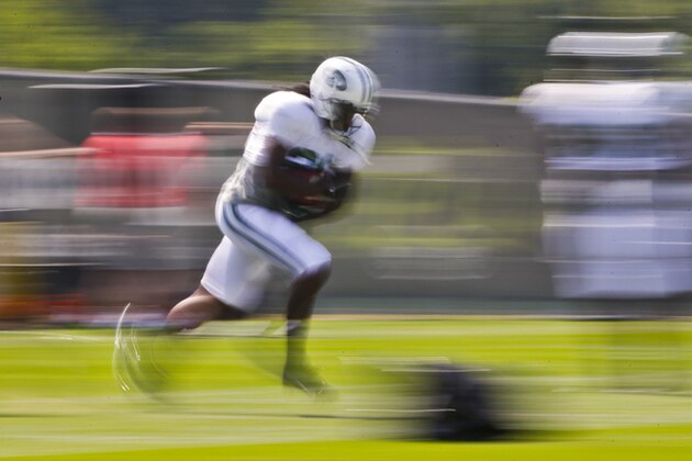 New York Jets' Chris Johnson runs during a drill at practice during NFL football training camp Saturday, July 26, 2014, in Cortland, N.Y.  (AP Photo)