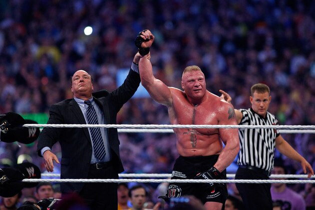 Paul Heyman, left, celebrates with Brock Lesnar after his win over the Undertaker during Wrestlemania XXX at the Mercedes-Benz Super Dome in New Orleans on Sunday, April 6, 2014. (Jonathan Bachman/AP Images for WWE) Paul Heyman, left, celebrates with Brock Lesnar after his win over the Undertaker during Wrestlemania XXX at the Mercedes-Benz Super Dome in New Orleans on Sunday, April 6, 2014. (Jonathan Bachman/AP Images for WWE)