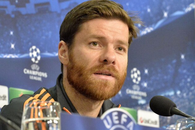 Real's Xabi Alonso talks to the media during  the press conference prior the UEFA Champions League first leg knock out soccer match between FC Schalke 04 and Real Madrid in Gelsenkirchen, Tuesday, Feb. 25, 2014.  (AP Photo/Martin Meissner)
