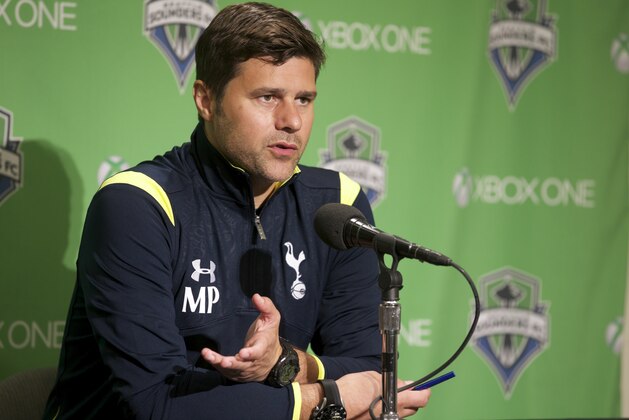 Tottenham Hotspur manager Mauricio Pochettino address the media after a friendly soccer match against the Seattle Sounders in Seattle, Saturday, July 19, 2014. The matched ended in a 3-3 draw. (AP Photo/Stephen Brashear)