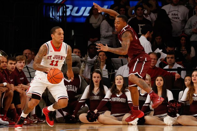 Dec 7, 2013; New York, NY, USA;  St. John's Red Storm guard D'Angelo Harrison (11) drives in from the outside during the first half against the Fordham Rams at Madison Square Garden. Mandatory Credit: Anthony Gruppuso-USA TODAY Sports